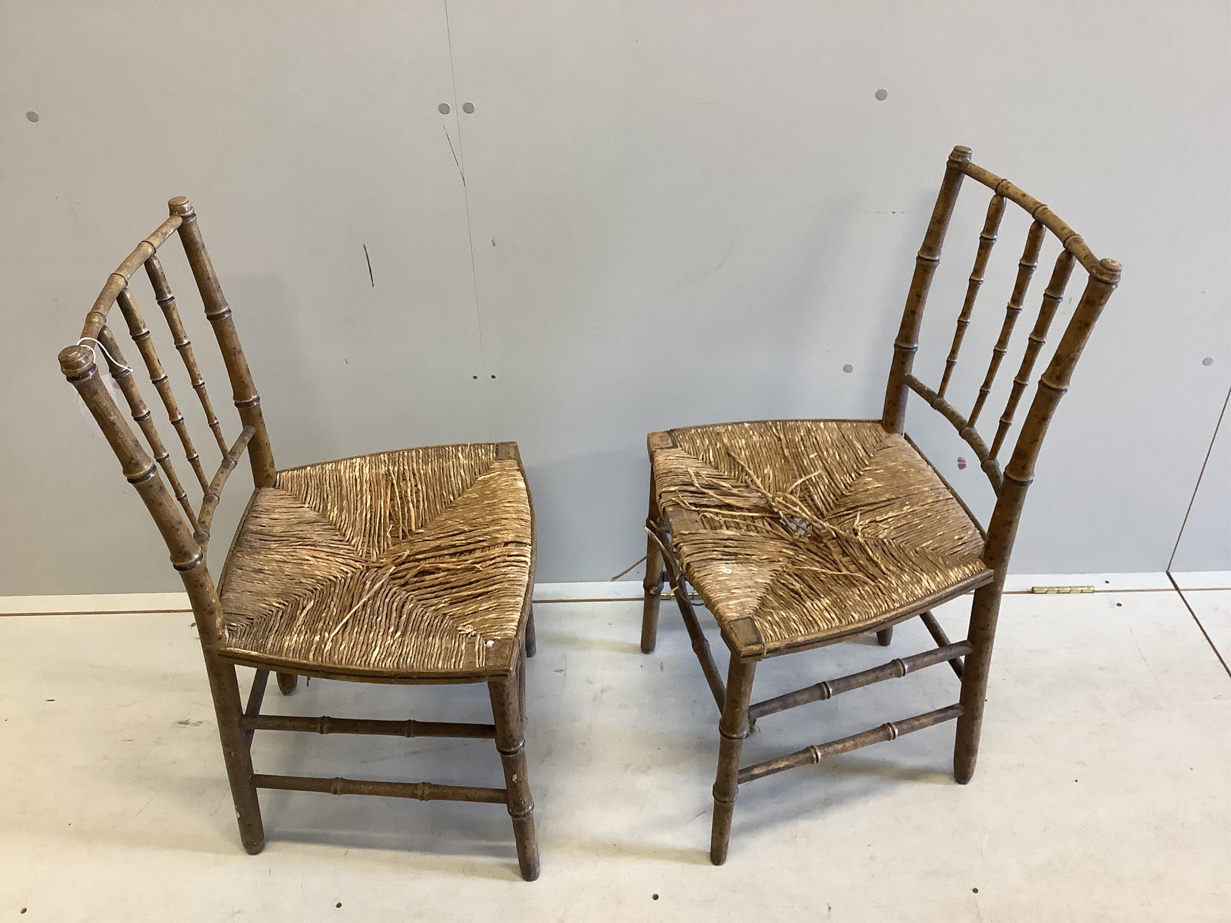 A pair of 19th century faux bamboo rush seat chairs, width 47cm, depth 40cm, height 87cm. Condition - poor